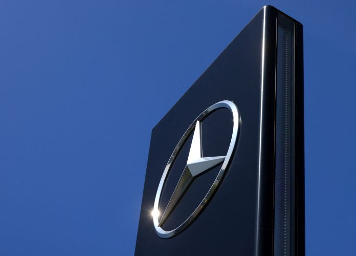 The logo of Mercedes-Benz is seen outside a Mercedes-Benz car dealer in Brussels